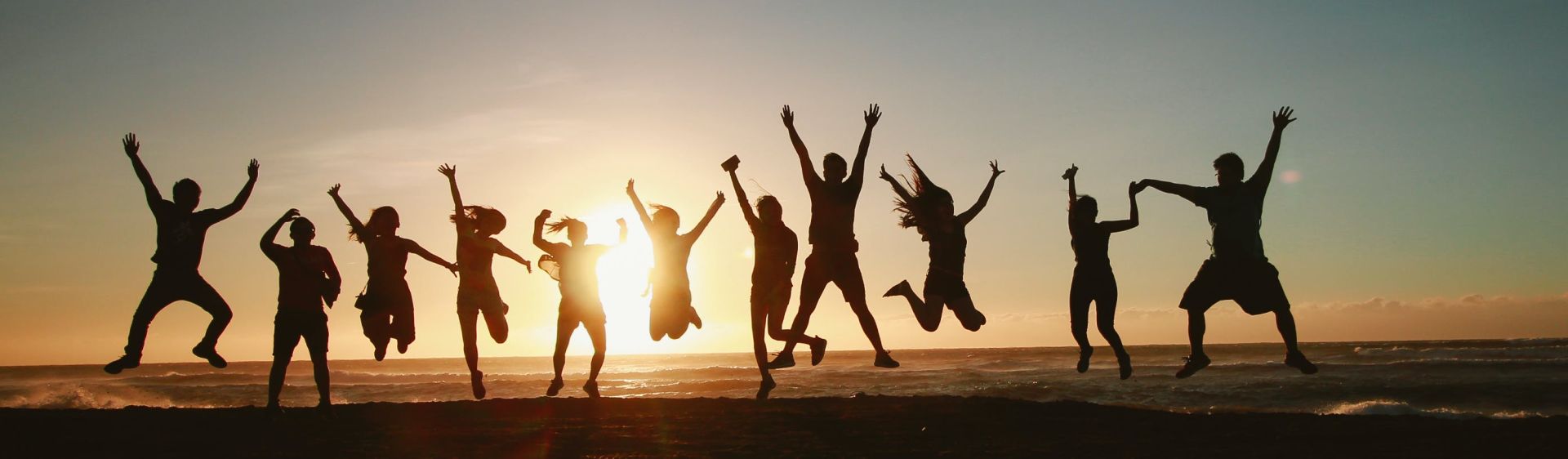 Silhouette Photography of Group of People Jumping during Golden Time